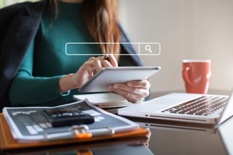 Women are sitting searching for information.